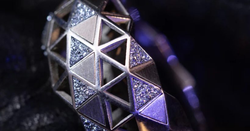 Exclusive osmium jewellery piece by designer brand showcasing rare metal inlay