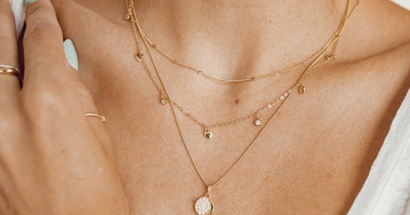 Delicate minimalist jewelry pieces with layered necklaces and rings for everyday wear